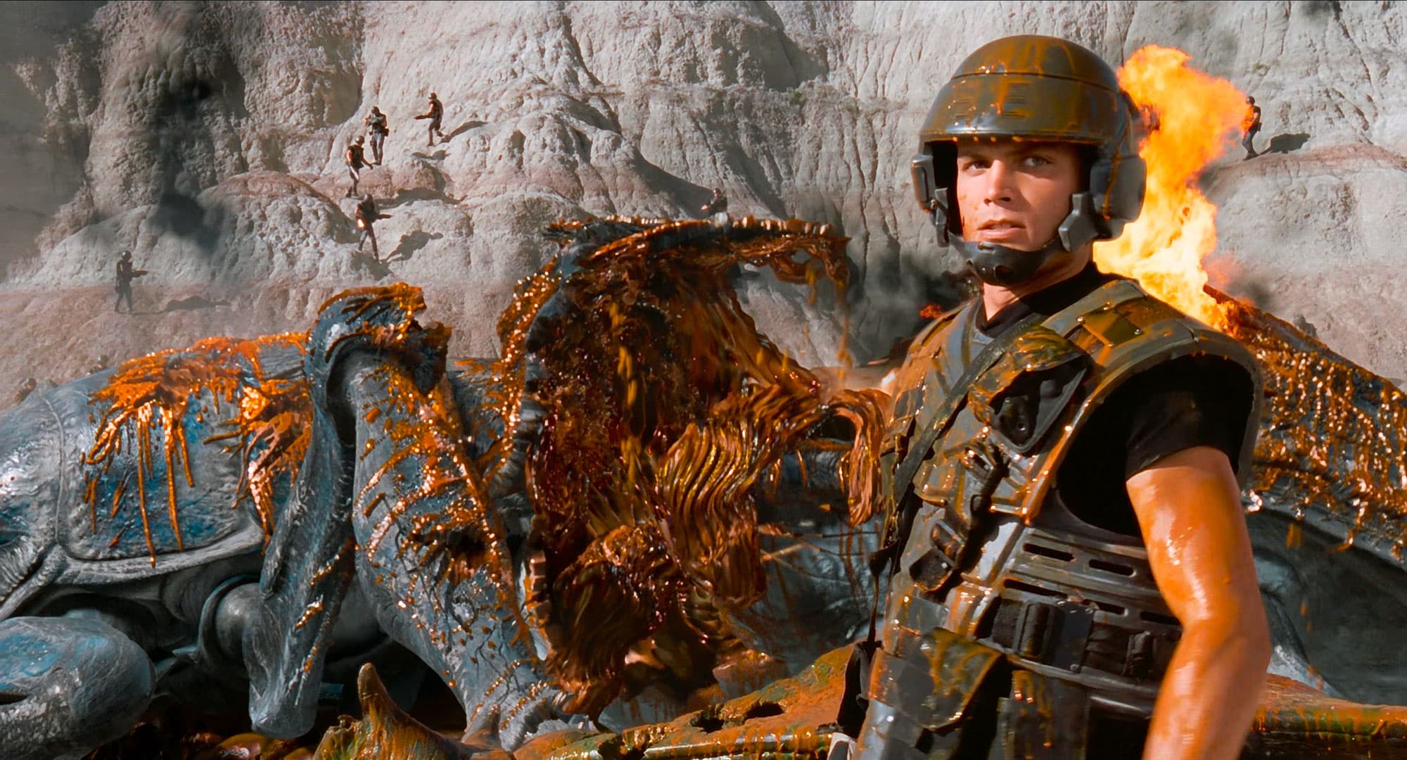 a still frame from Starship Trooper (1997) featuring orange alien blood