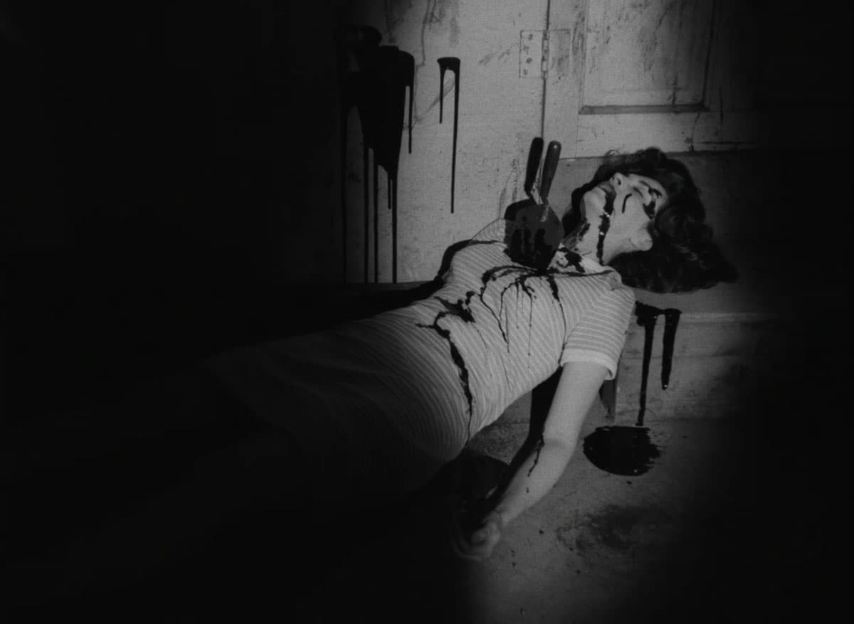 fake blood splattered over woman on the ground