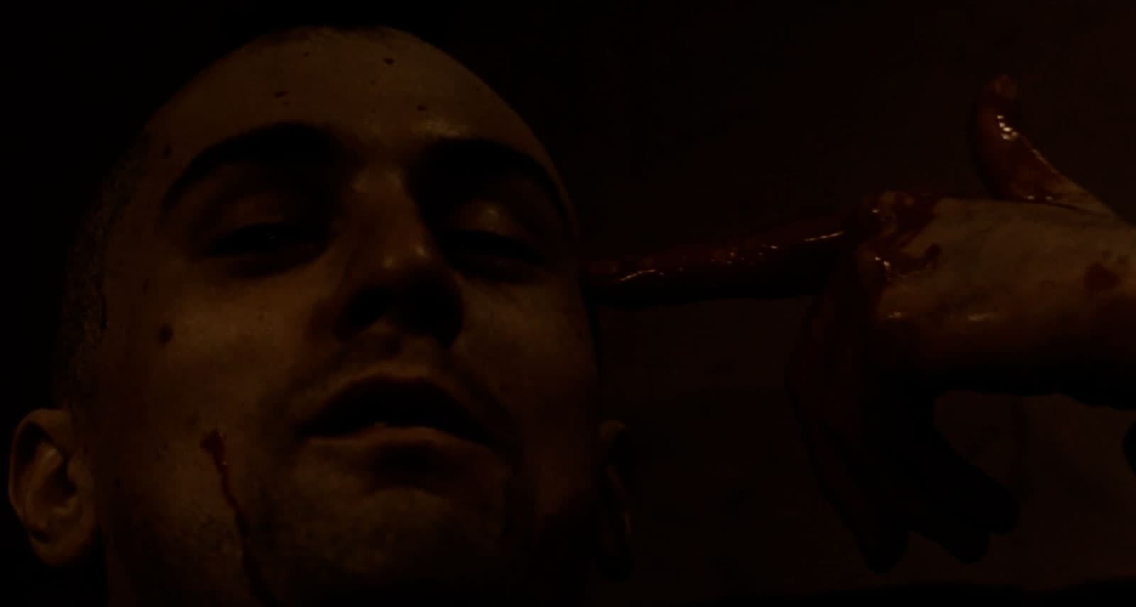 Robert DeNiro with blood on his hands and face